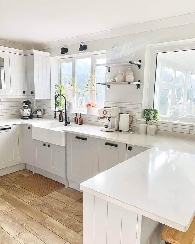 13. Classic White Farmhouse Kitchen with Grey Accents - grey and white kitchen ideas