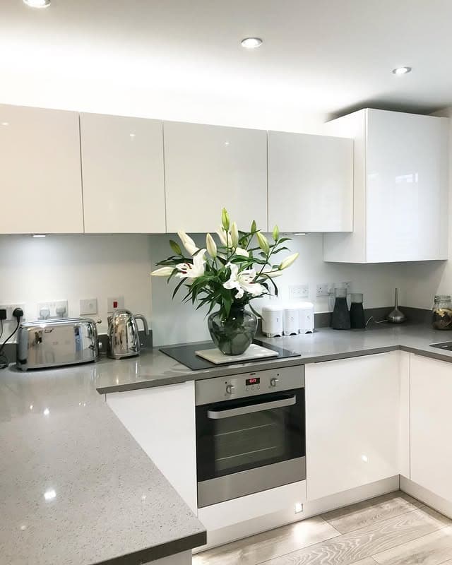 15. Minimal White Cabinets with Grey Worktops Kitchen - grey and white kitchen ideas