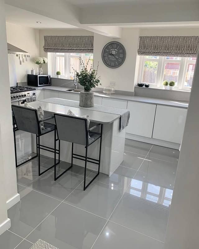 19. Minimal Grey and White Kitchen with Dining Peninsula - grey and white kitchen ideas