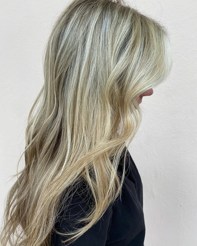 3. Layered Sandy Blonde Blowout - Sandy Hair Color
