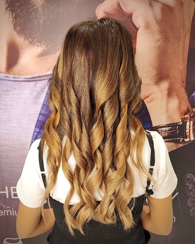 7. Sandy Caramel Balayage Curls - Sandy Hair Color