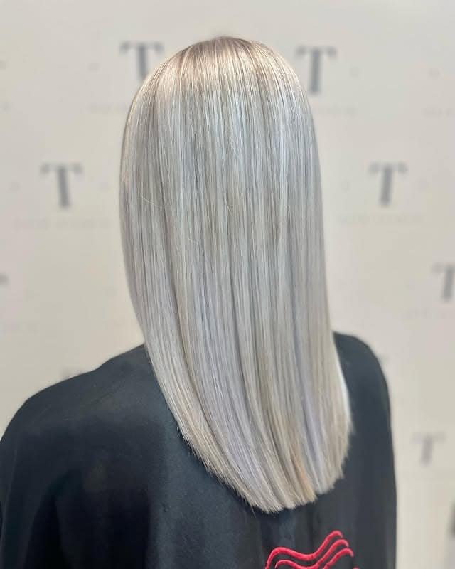 11. Icy Sandy Blonde Sleek Blunt Cut - Sandy Hair Color