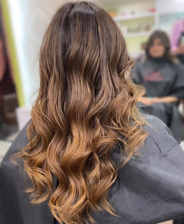 14. Sandy Caramel Melt Soft Waves - Sandy Hair Color