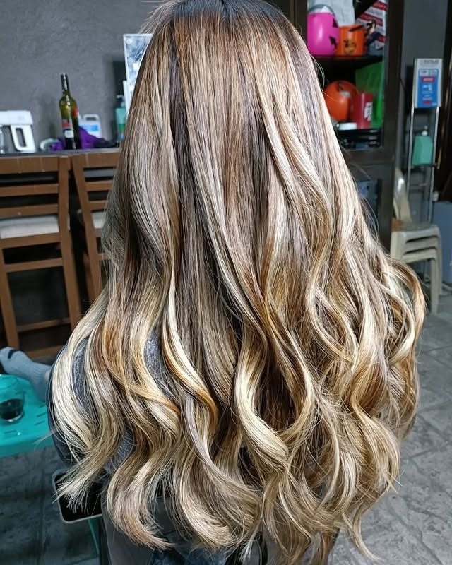 15. Sandy Beige Balayage Long Waves - Sandy Hair Color