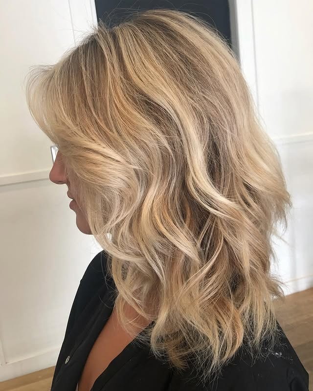 21. Layered Sandy Blonde Soft Waves - Sandy Hair Color