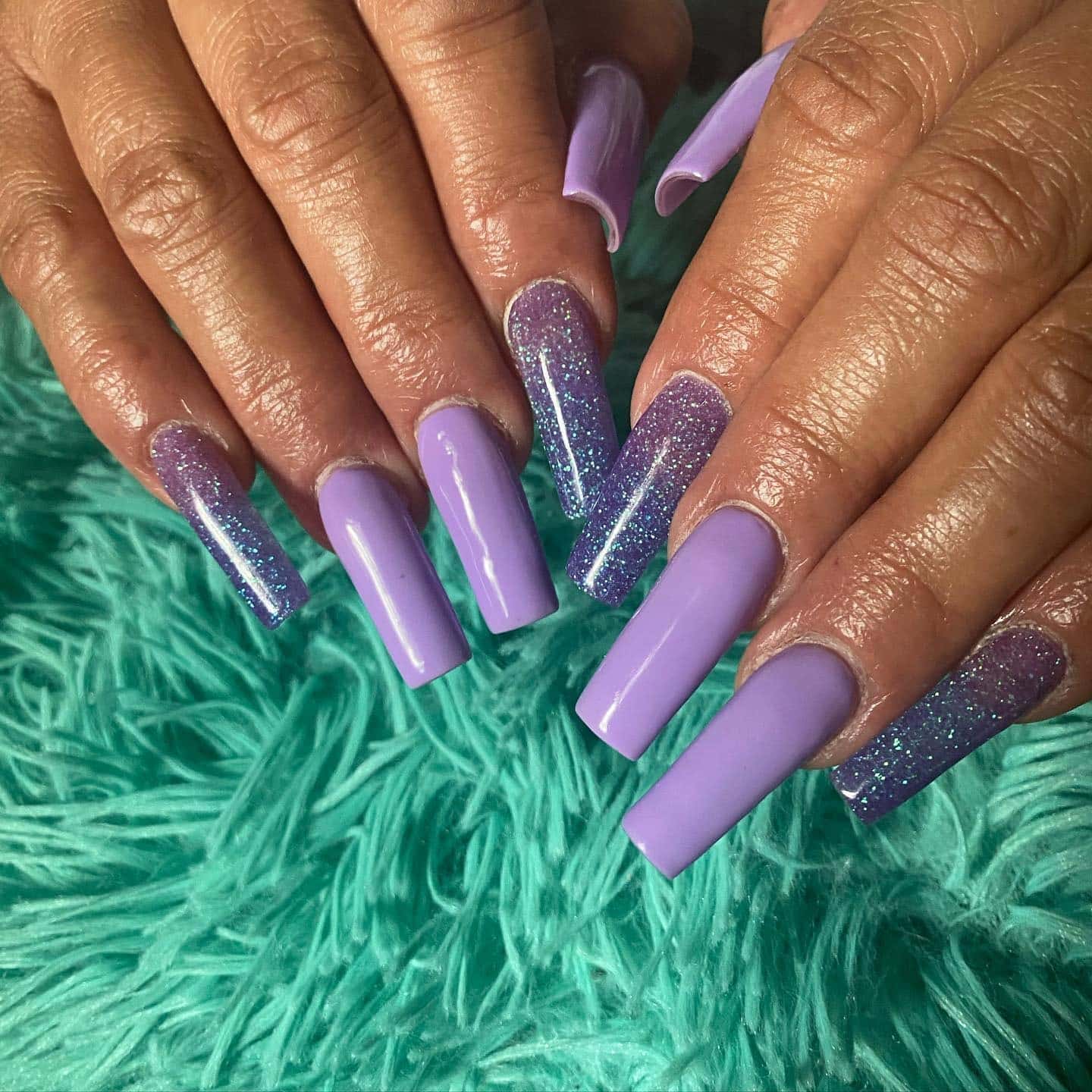 2. Matte Lilac Coffin Nails with Purple Glitter Accents - purple coffin nail ideas