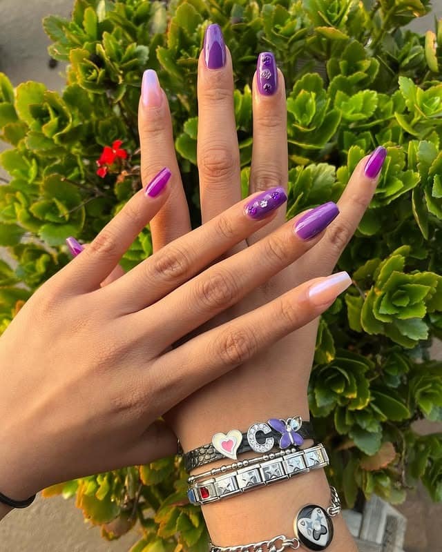 7. Short Purple Gloss Nails with Minimal Rhinestone Art - purple coffin nail ideas