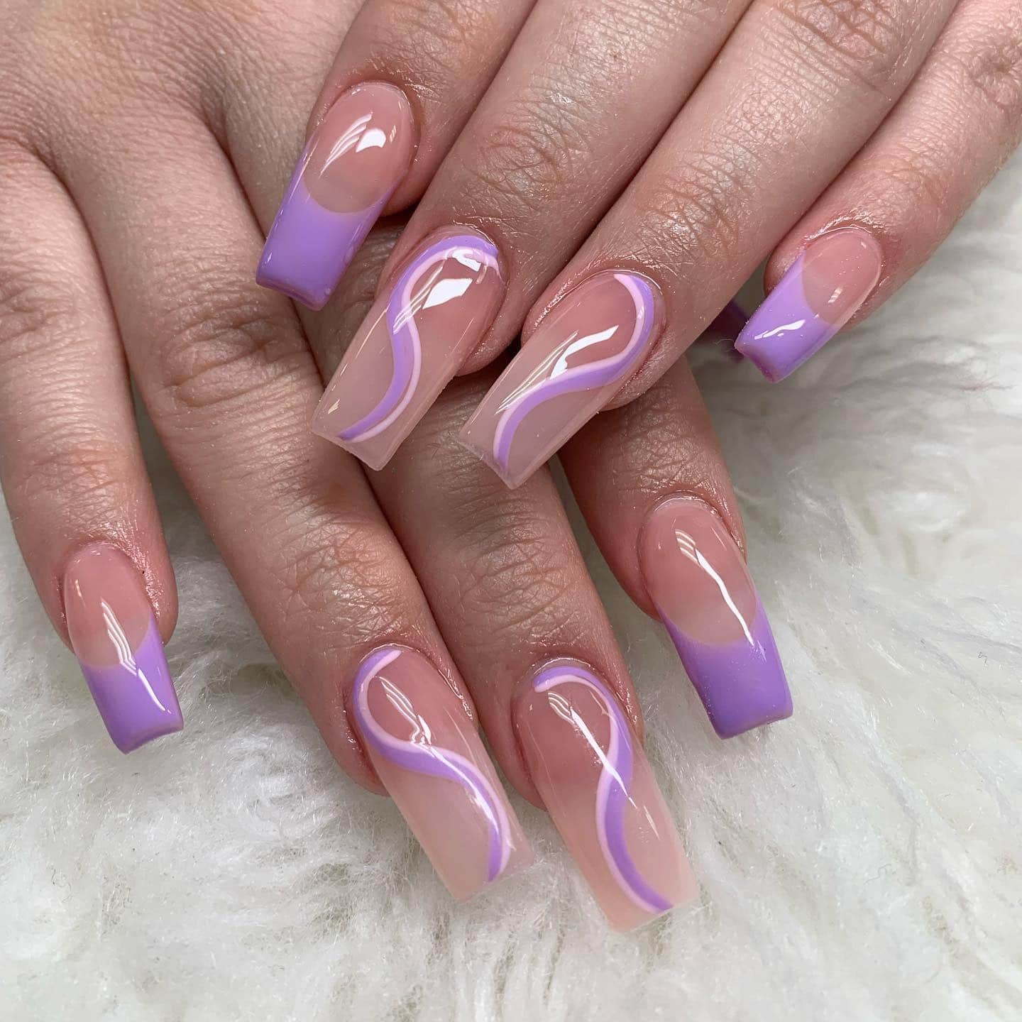 13. Nude Coffin Nails with Lavender French Tips and Soft Swirls - purple coffin nail ideas