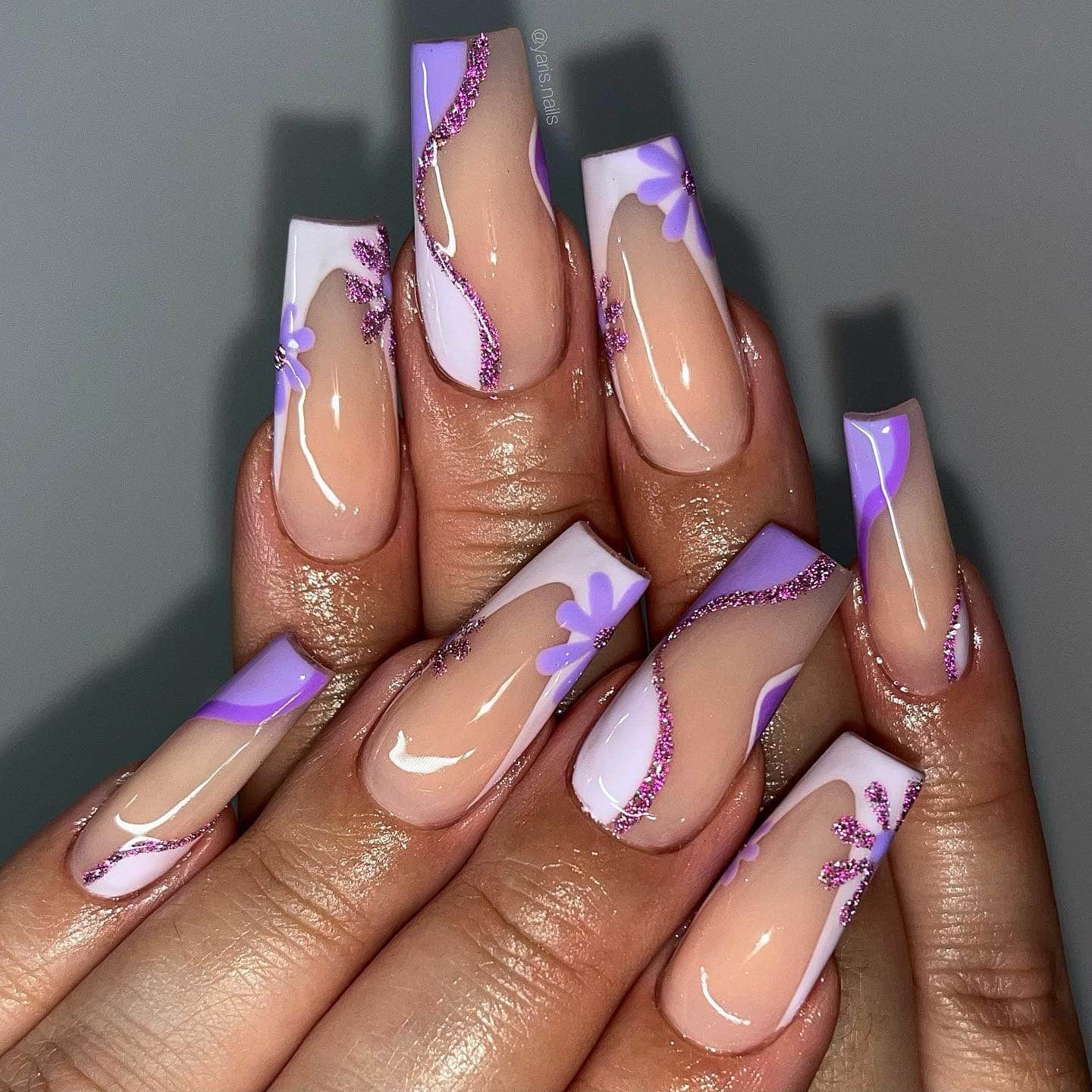 15. Lavender Coffin Nails with Glitter Wave and Floral Details - purple coffin nail ideas