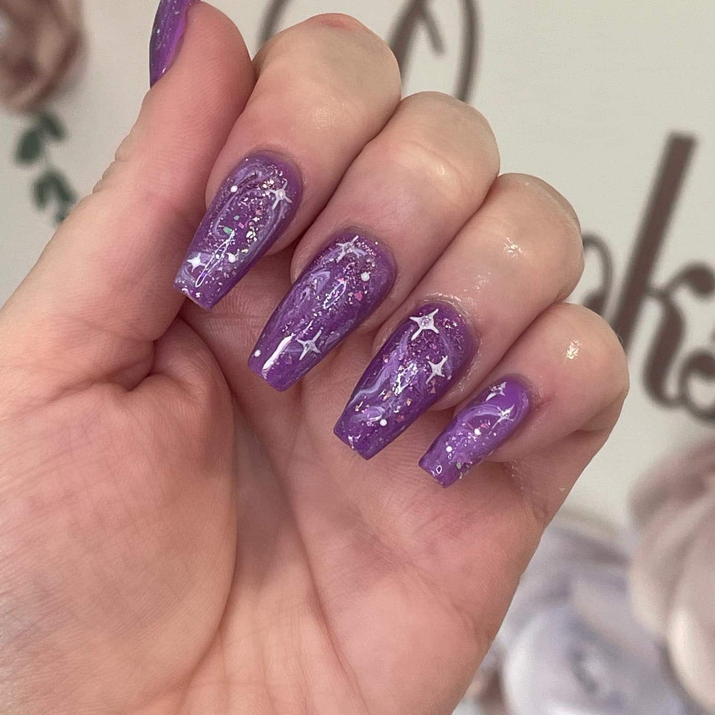 16. Galaxy Purple Glitter Coffin Nails with Star Art - purple coffin nail ideas