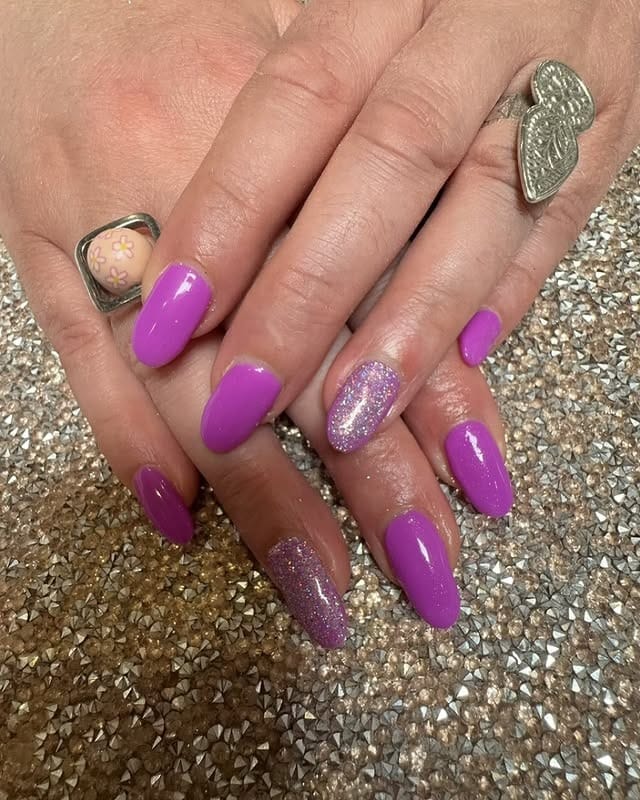 1. Glossy Orchid Almond Nails with Glitter Accent - purple glitter nail ideas