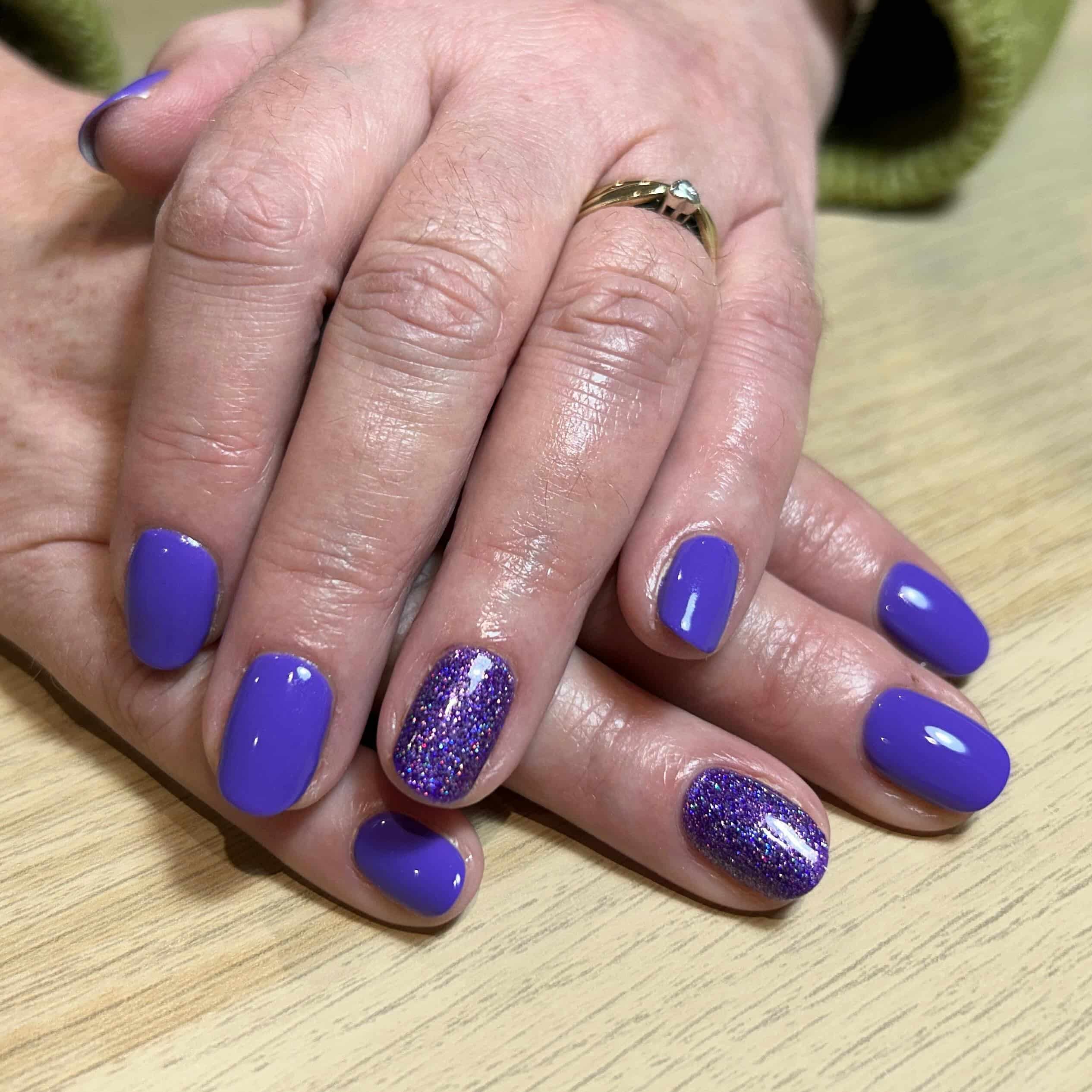 6. Periwinkle Short Nails with Glitter Accent - purple glitter nail ideas