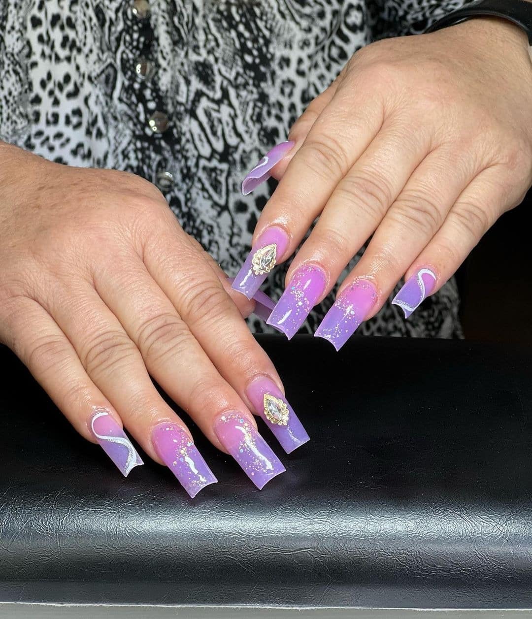 9. Lavender Coffin Nails with Swirls, Glitter, and Charms - purple glitter nail ideas