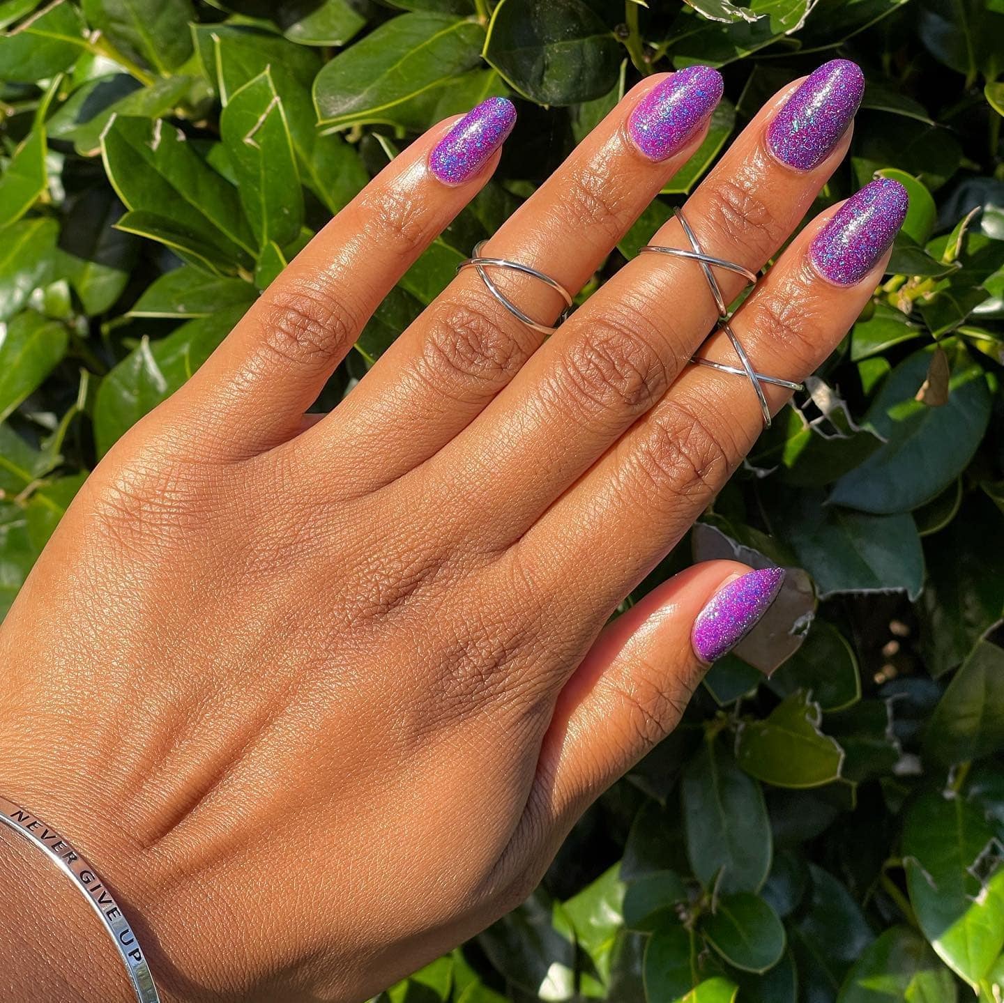 11. Purple Holographic Glitter Almond Nails - purple glitter nail ideas