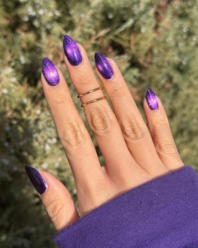 12. Galaxy Purple Cat-Eye Almond Nails - purple glitter nail ideas