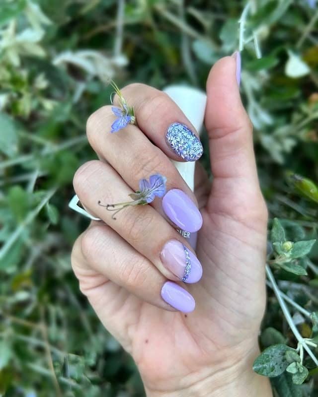 17. Lavender Short Oval Nails with Silver Glitter Accent - purple glitter nail ideas