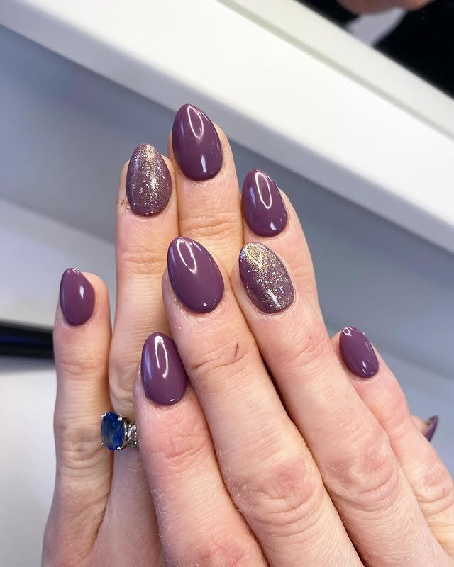 18. Dusty Plum Almond Nails with Gold Glitter Accent - purple glitter nail ideas