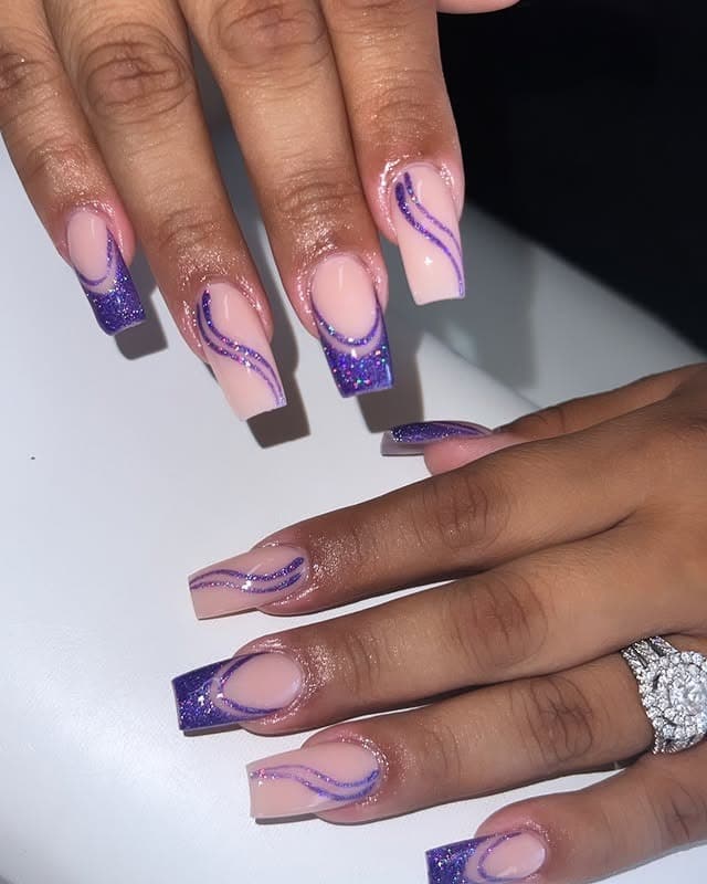 20. Nude and Purple Glitter Wave Coffin Nails - purple glitter nail ideas