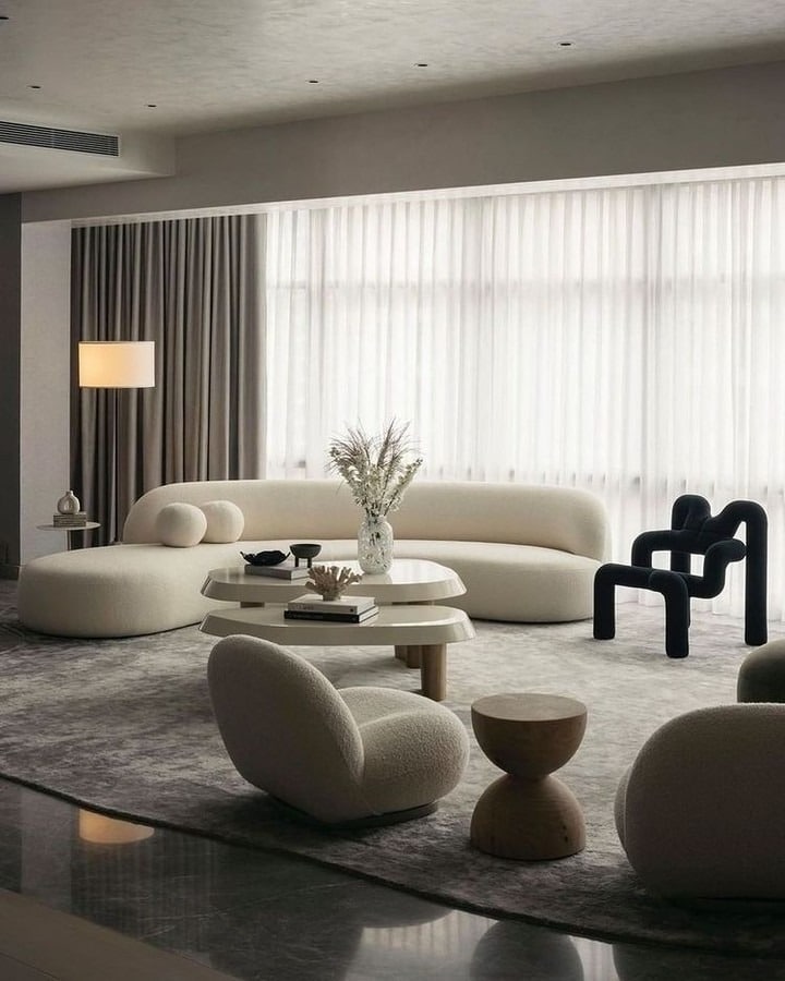 12. Sculptural Minimalist Living Room in Cream and Charcoal - minimalist living room ideas