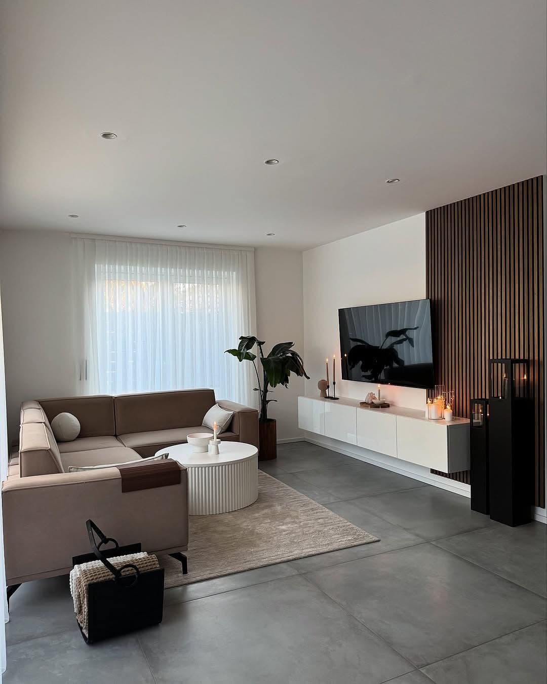 15. Modern Minimalist Living Room in Beige and Black Accents - minimalist living room ideas