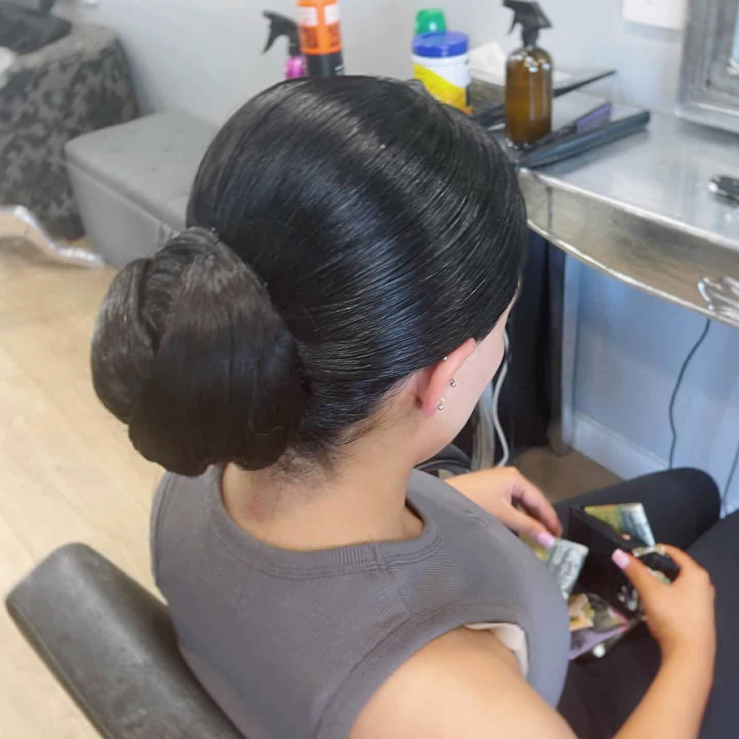 3. Classic Low Slick Bun in Deep Espresso Brown - Slick Back Hairstyles