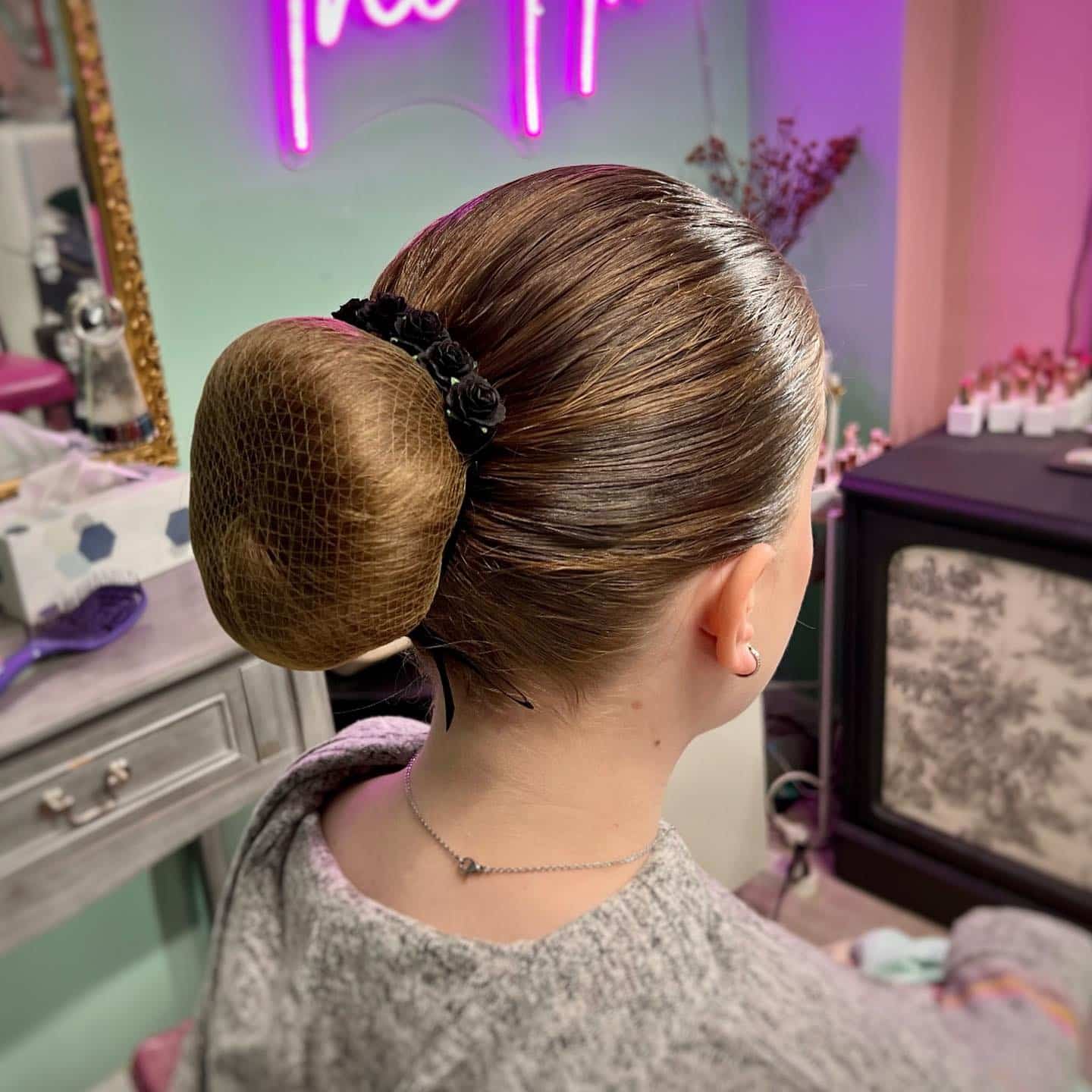 4. Sleek Donut Bun with Golden Light Brown Shine - Slick Back Hairstyles