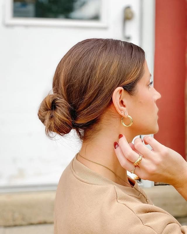 6. Minimalist Low Bun in Soft Chestnut Brown - Slick Back Hairstyles