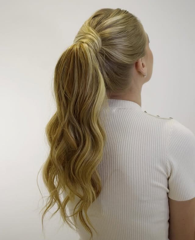 12. High Wavy Ponytail with Honey Blonde Dimension - Slick Back Hairstyles