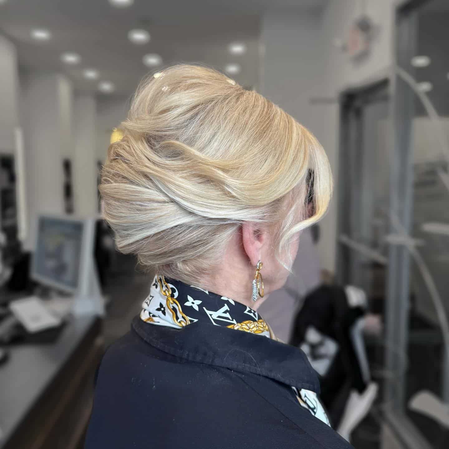 13. Sculpted French Twist Bun in Soft Platinum Blonde - Slick Back Hairstyles