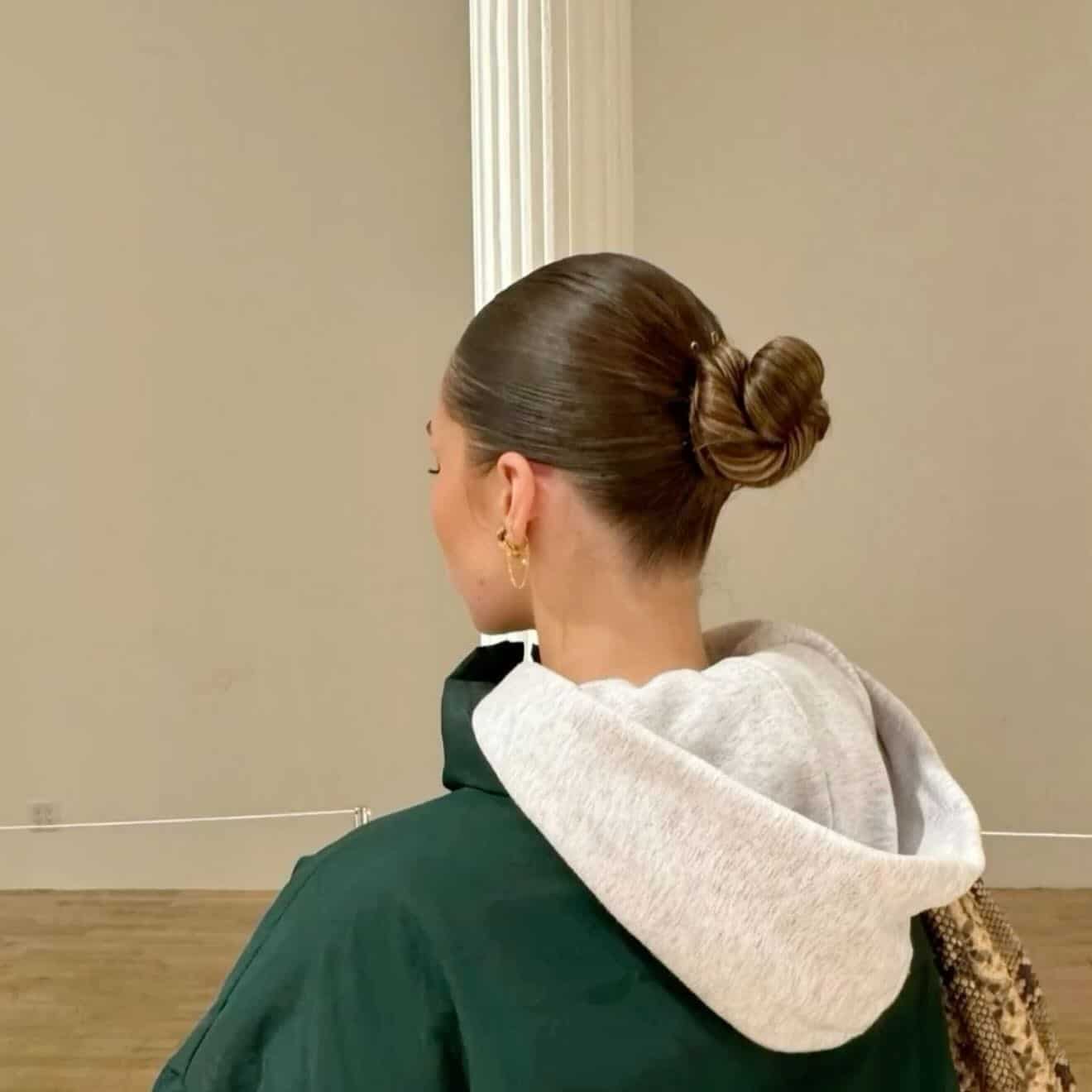 16. Minimalist Low Bun with Golden Light Brown Finish - Slick Back Hairstyles