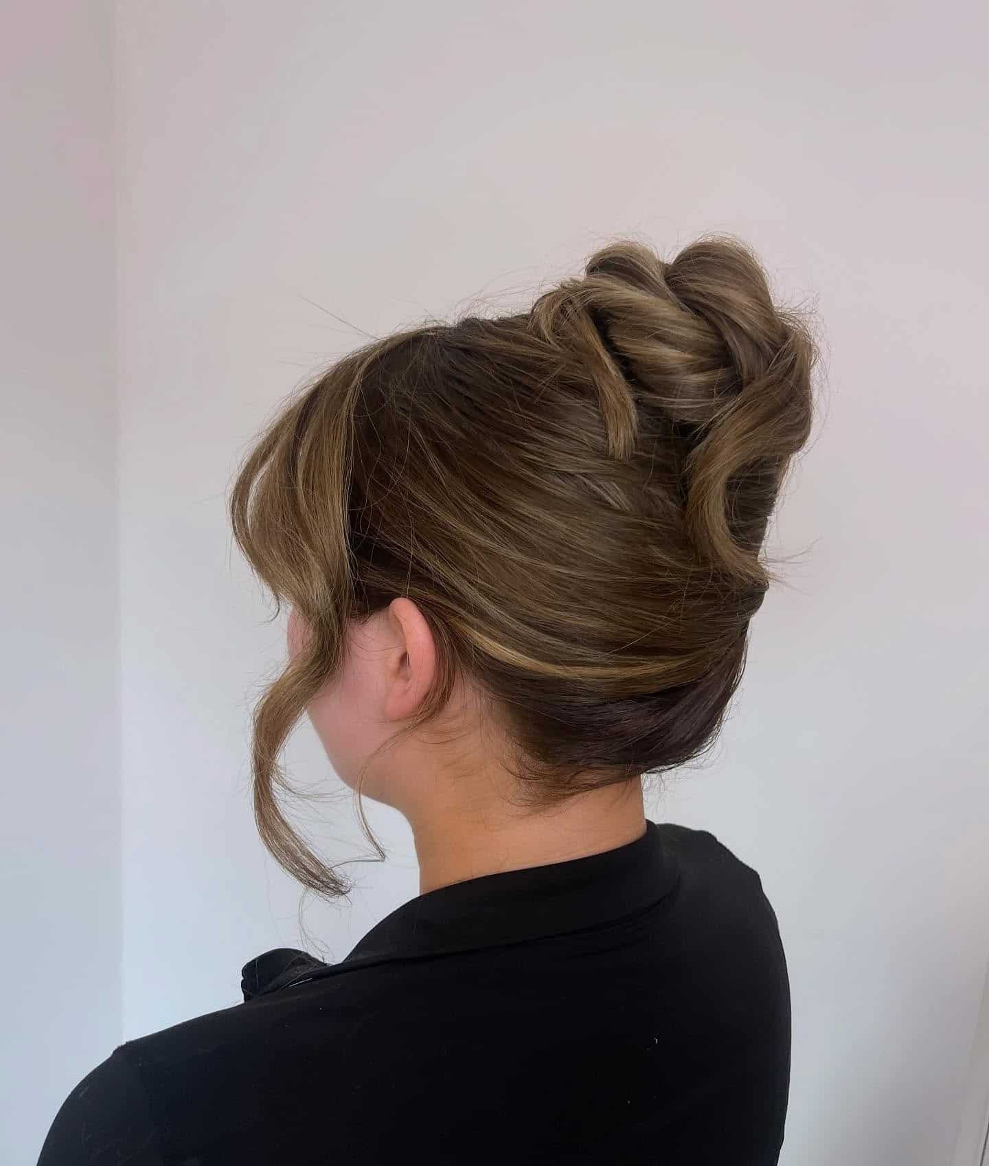 17. Soft Twisted Bun with Caramel Brown Highlights - Slick Back Hairstyles