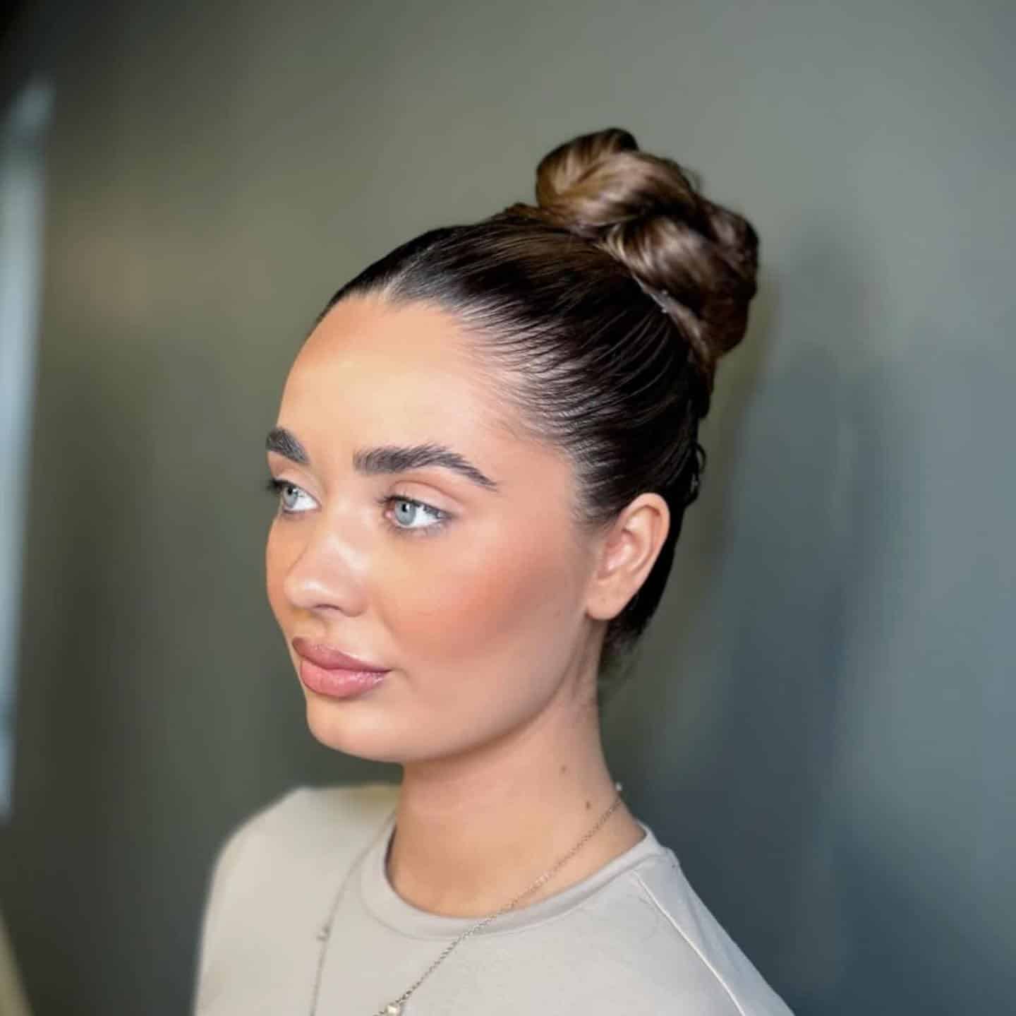 19. High Gloss Ballet Bun in Dark Brunette - Slick Back Hairstyles