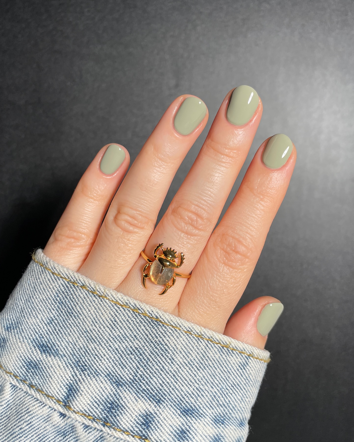 5. Muted Sage Round Nails with Gold Statement Ring - sage nail ideas