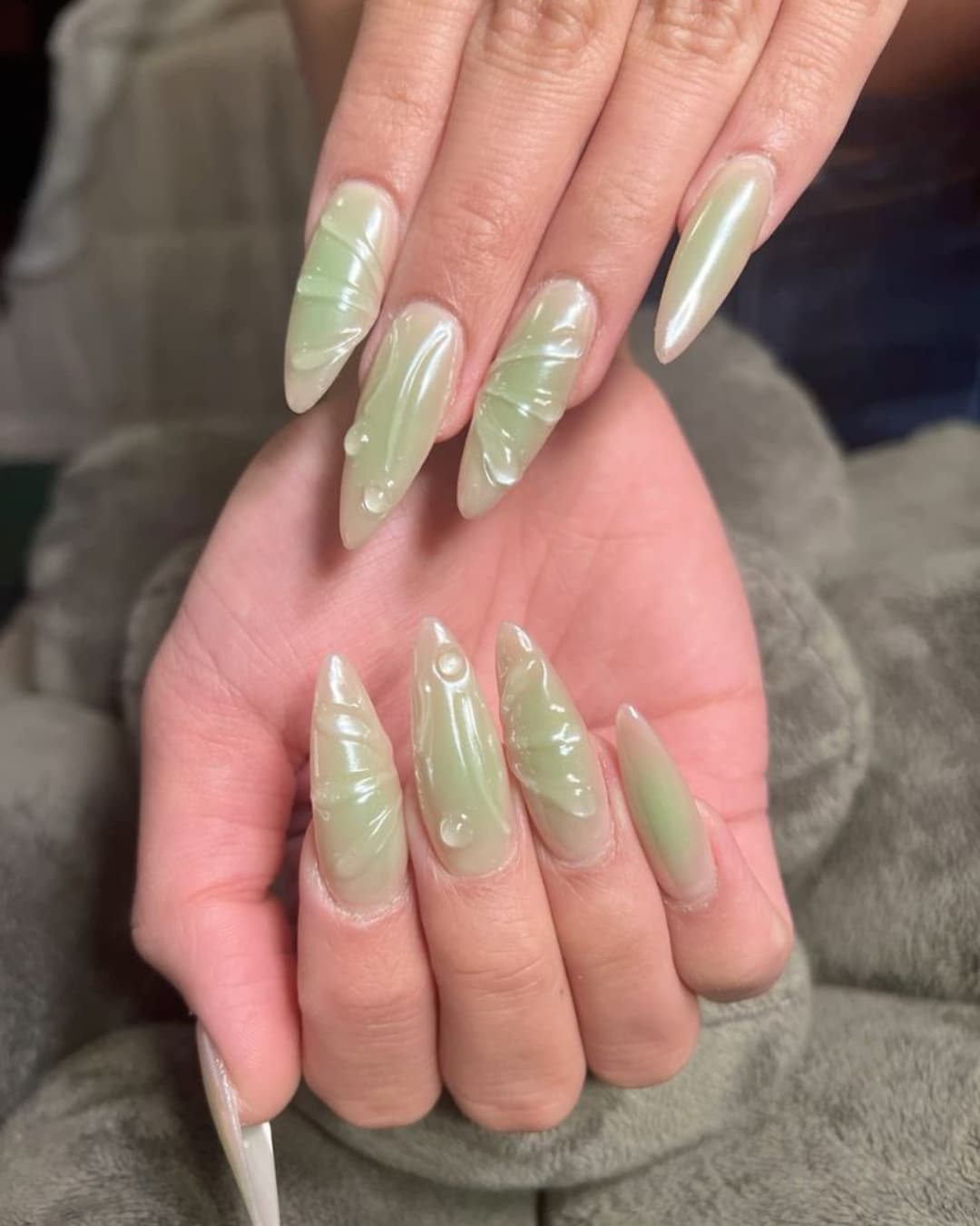 11. Glossy Sage Aura Stiletto Nails with 3D Gel Texture - sage nail ideas