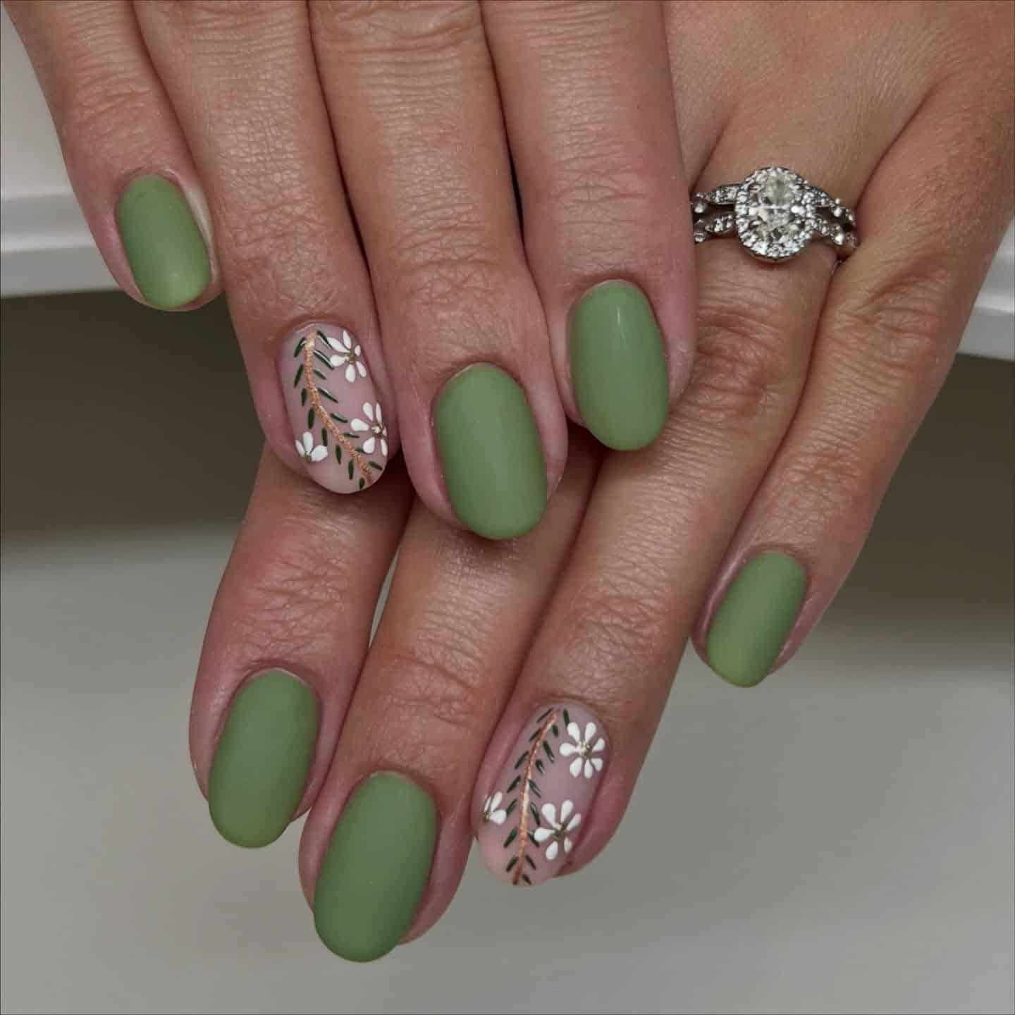 16. Matte Sage Oval Nails with White Daisy Accent - sage nail ideas