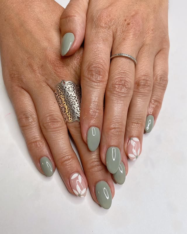 17. Dusty Sage Almond Nails with Minimal Leaf Art - sage nail ideas