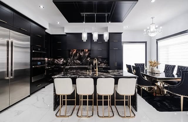 8. Luxury Black Kitchen with Dramatic Marble Island - white and black kitchen ideas