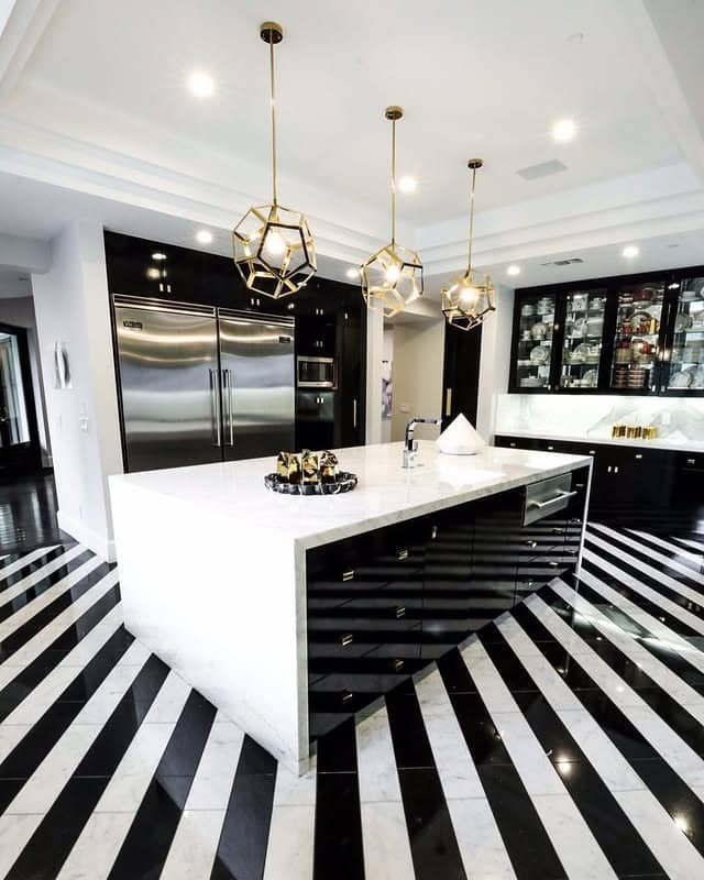 12. Glam Black and White Kitchen with Geometric Lighting - white and black kitchen ideas