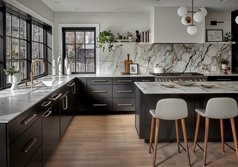 13. Modern Black Kitchen with Marble Feature Backsplash - white and black kitchen ideas