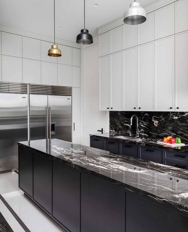 16. Luxury White Cabinet Kitchen with Black Marble Island - white and black kitchen ideas