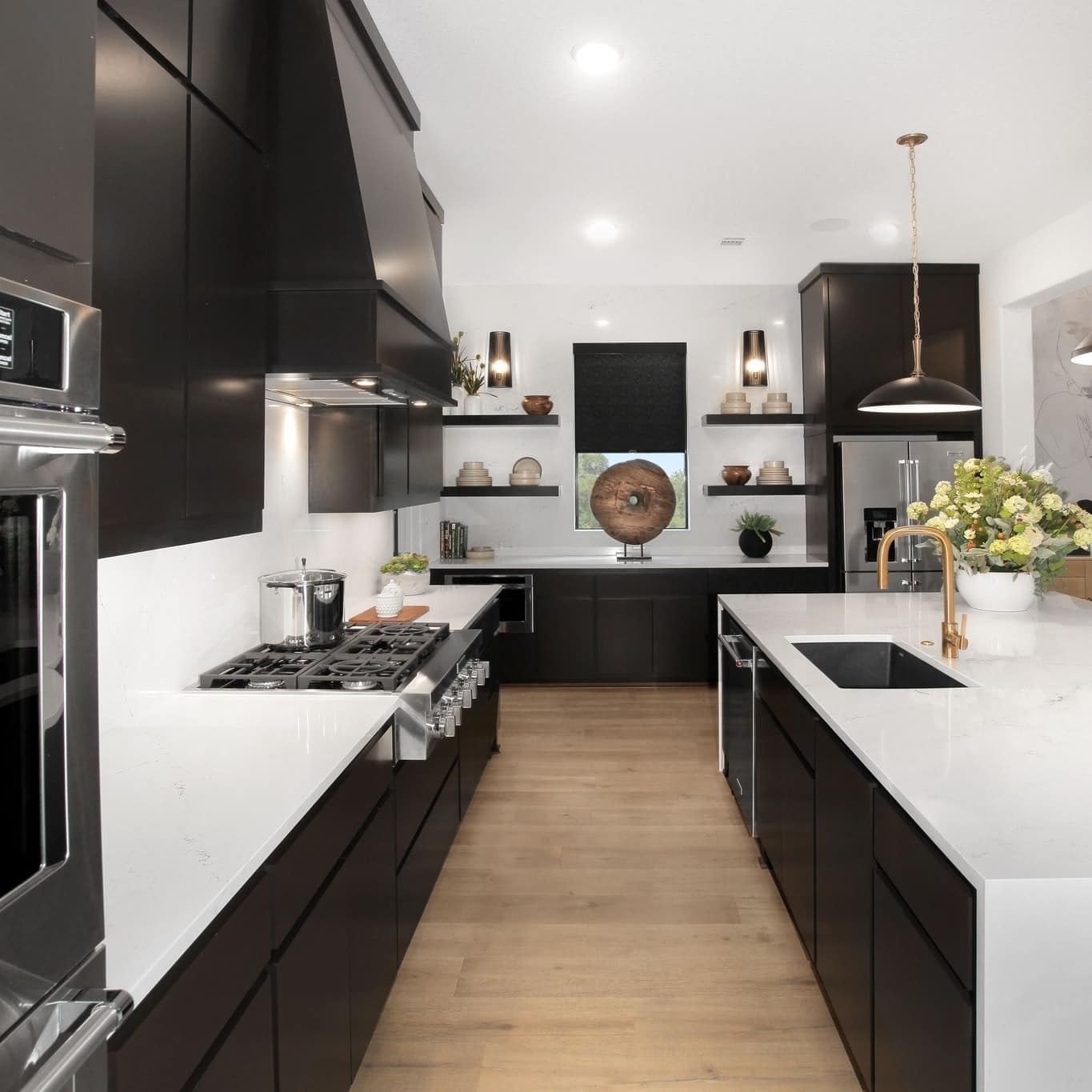 18. Modern Black Cabinet Kitchen with White Countertops - white and black kitchen ideas