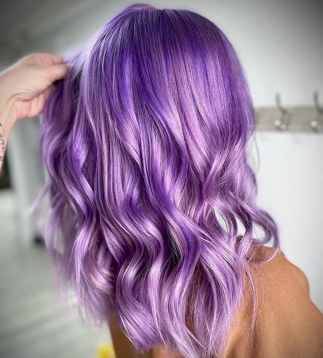13. Glossy Lilac Layered Waves - Light Purple Hair Color