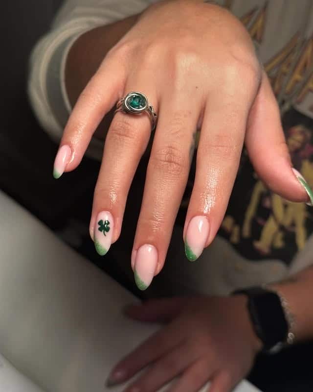 22. Soft Green Glitter French Almond Nails - saint patrick's day nail ideas