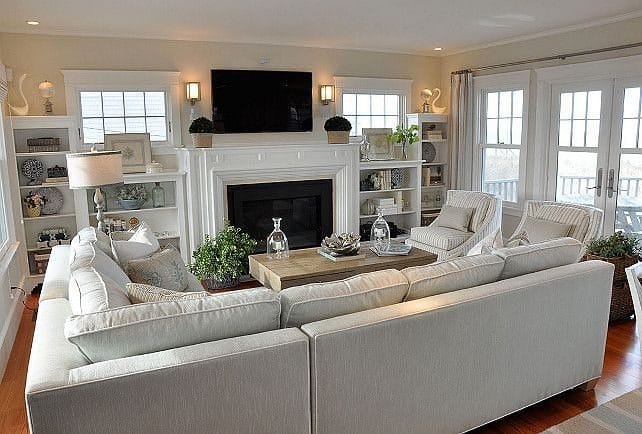 19. Bright White Living Room with Built-In Shelving and Fireplace - living room ideas with fireplace