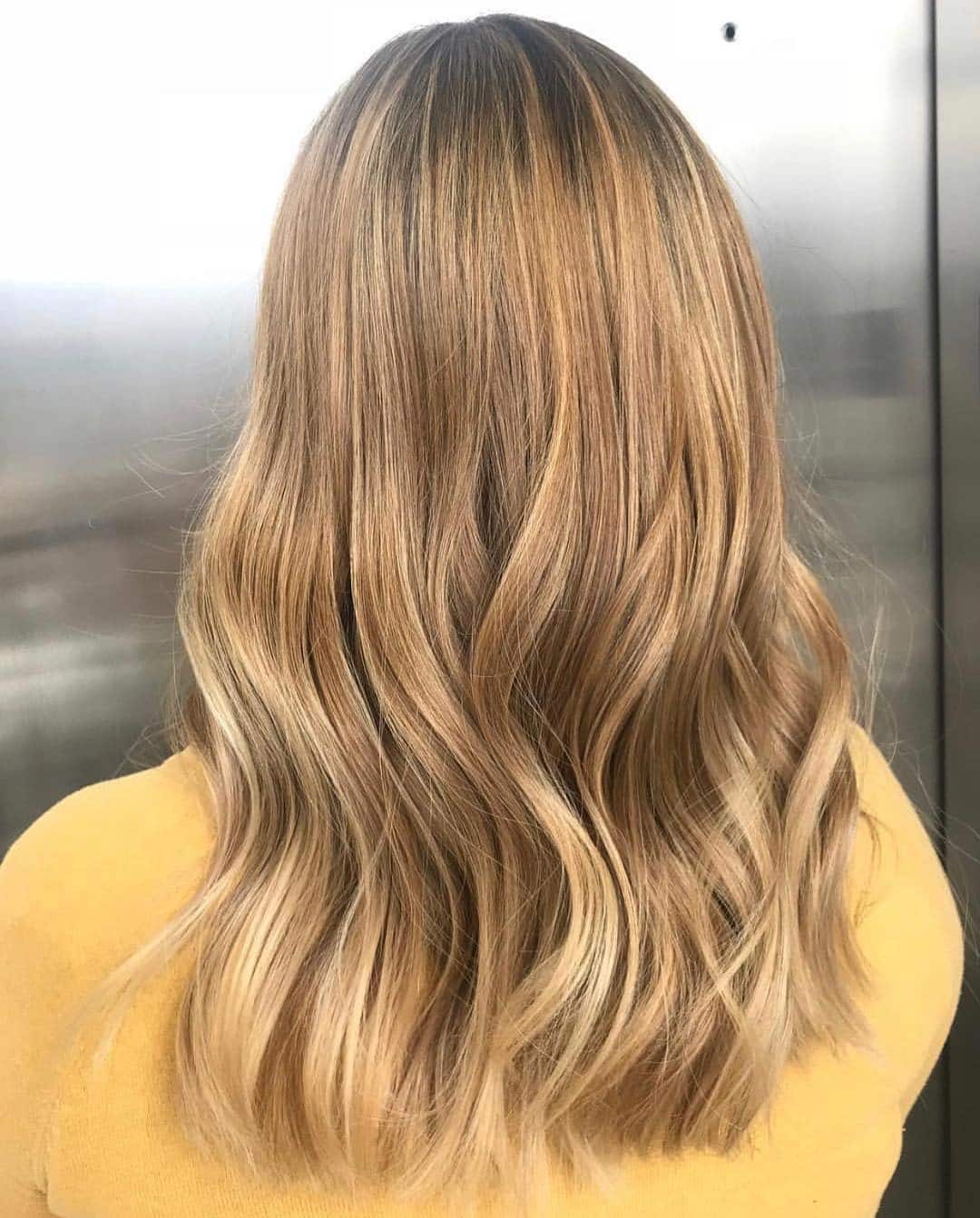 1. Soft Caramel Balayage with Loose Waves - Warm Blonde Hair Color