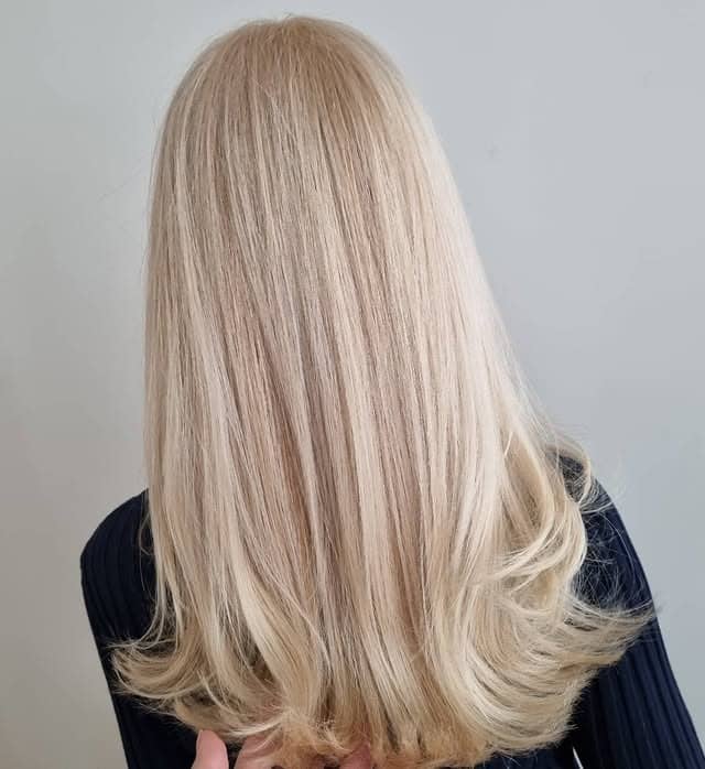 3. Buttery Champagne Blonde with Sleek Finish - Warm Blonde Hair Color