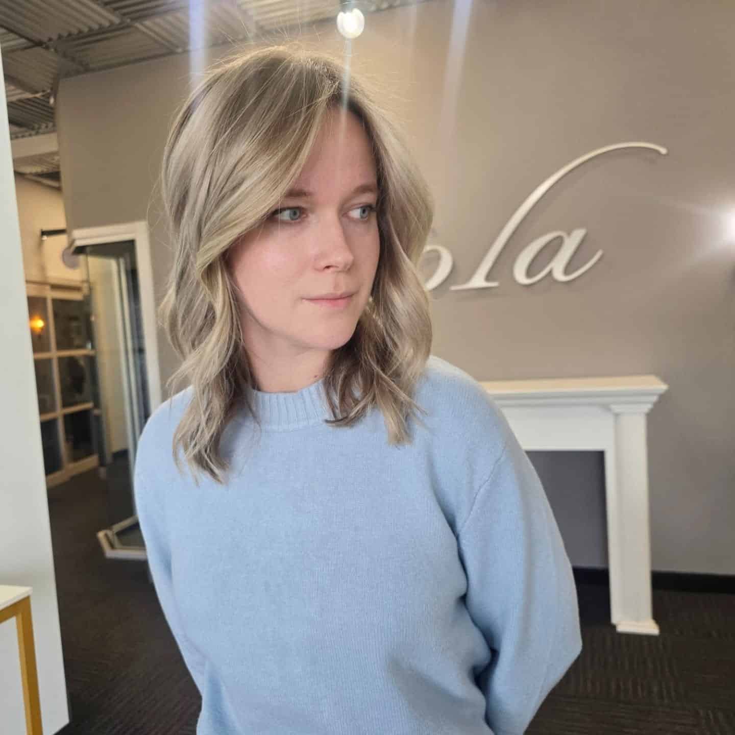 8. Sandy Blonde Waves with Dimensional Layers - Warm Blonde Hair Color