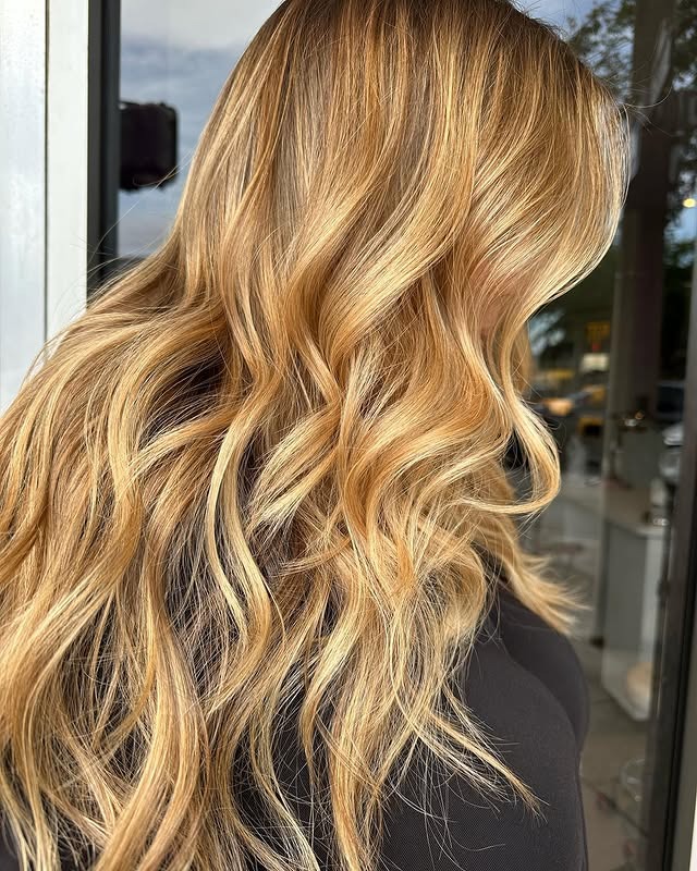 9. Honey Blonde Money Piece with Soft Waves - Warm Blonde Hair Color