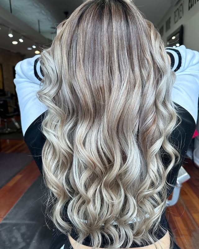 15. Cool-Warm Blend Blonde with Long Cascading Waves - Warm Blonde Hair Color