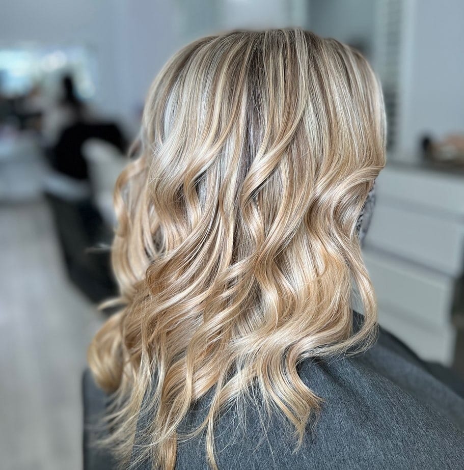 18. Neutral Blonde Mid-Length Waves with Depth - Warm Blonde Hair Color